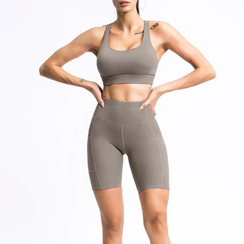 Novo estilo de roupas de yoga mulheres, de secagem rápida e beleza de volta terno de esportes de alta bolsos de cintura mostrando quadris de fitness, roupas de treino mulheres